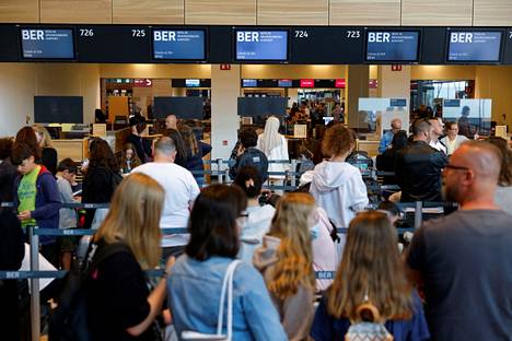 Passengers line up at Brandenburg Airport near Berlin on July 7.