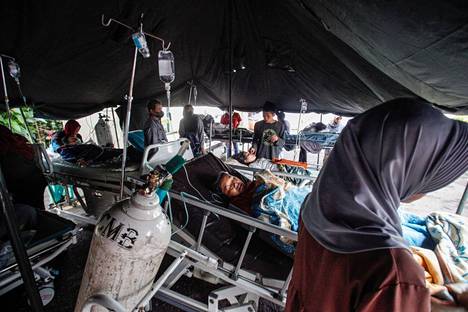 Earthquake victims were treated at a tent clinic in Cianjur district on Monday.