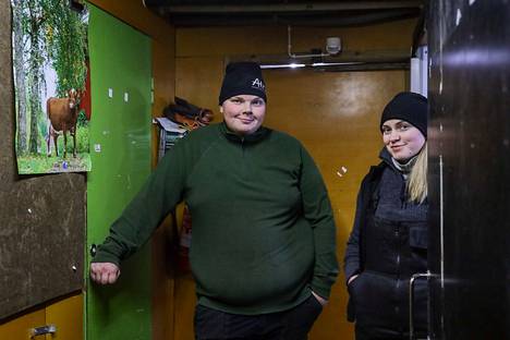 Ville Puhakka and Kaisa Peura in the hall of their barn.