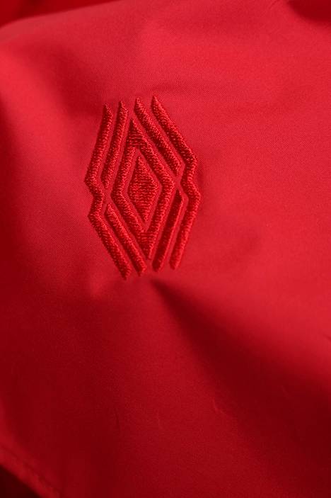 A detail in the garment designed by Lauri Greis, which combines Antrea's national costume and sportswear.