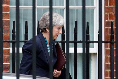 Pääministeri Theresa May vakuuttaa, että Britannia eroaa EU:sta 29. maaliskuuta.