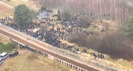 Hundreds of migrants fled from Belarus to Poland near the village of Kuźnica on 8 November.  Screenshot of a video provided by the Polish Ministry of Defense.