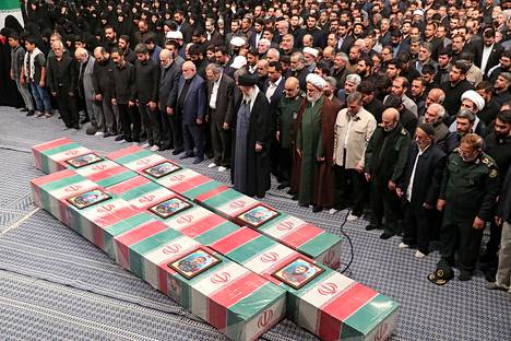 The Revolutionary Guards who died in the attack on Damascus, Syria, were remembered in Tehran on April 4.  In the foreground, Iran's supreme religious leader Ali Khamenei.