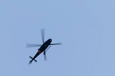 The helicopter flying above the Turkish house.