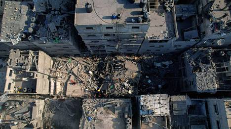 Buildings destroyed by an airstrike in the al-Shati refugee camp in Gaza on Thursday.