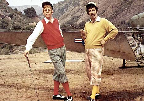 Sutherland (left) and Elliott Gould on the set of MASH (1970).