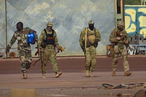 Three Russian mercenaries in Mali in an undated photo.