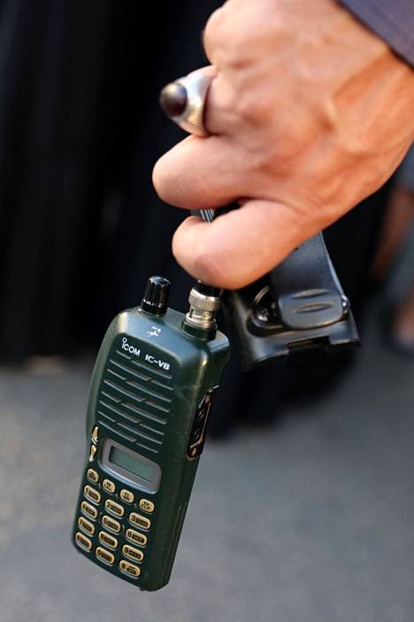 A man held a walkie-talkie at a funeral in Beirut on Wednesday.