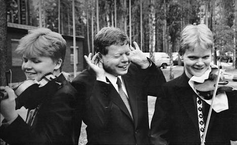 Brothers Pekka and Jaakko Kuusisto with their father Ilkka (middle).