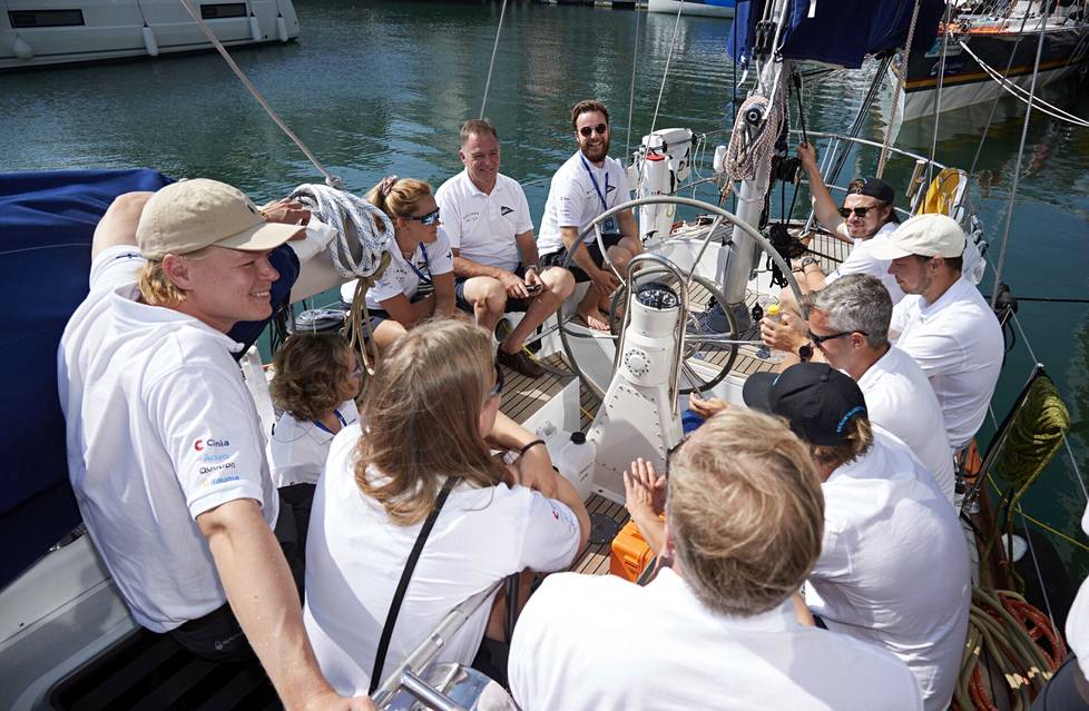 The team of the Galiana boat holding a meeting on the deck of the boat.