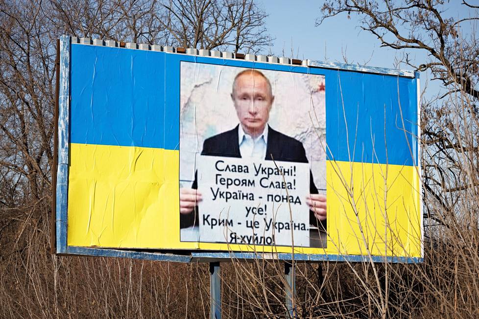 Russian President Vladimir Putin at the Ukrainian propaganda poster in Zaporizhia.