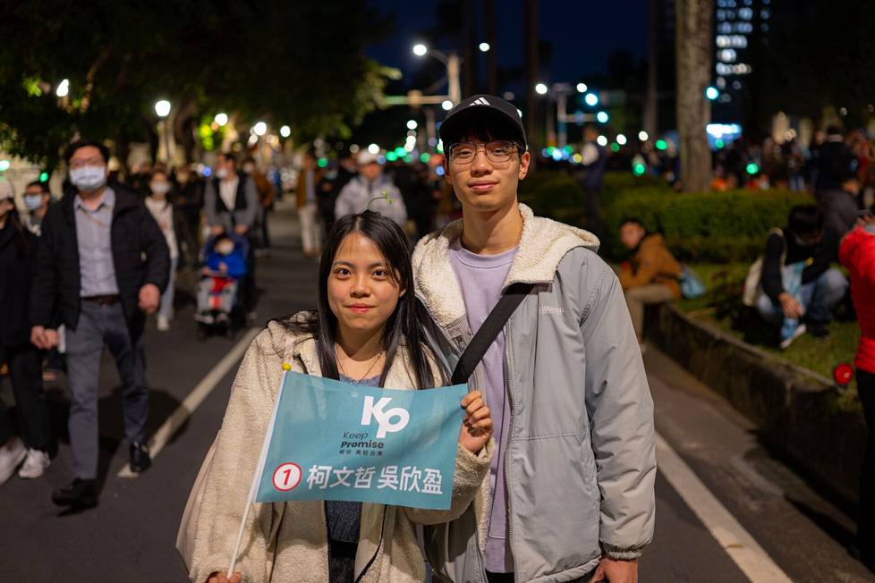 Li Alice (left), who came to TPP's campaign event with her boyfriend, votes for Ko Wen-je, because she believes that he is the best one to intervene in issues important to young people, such as housing costs.  