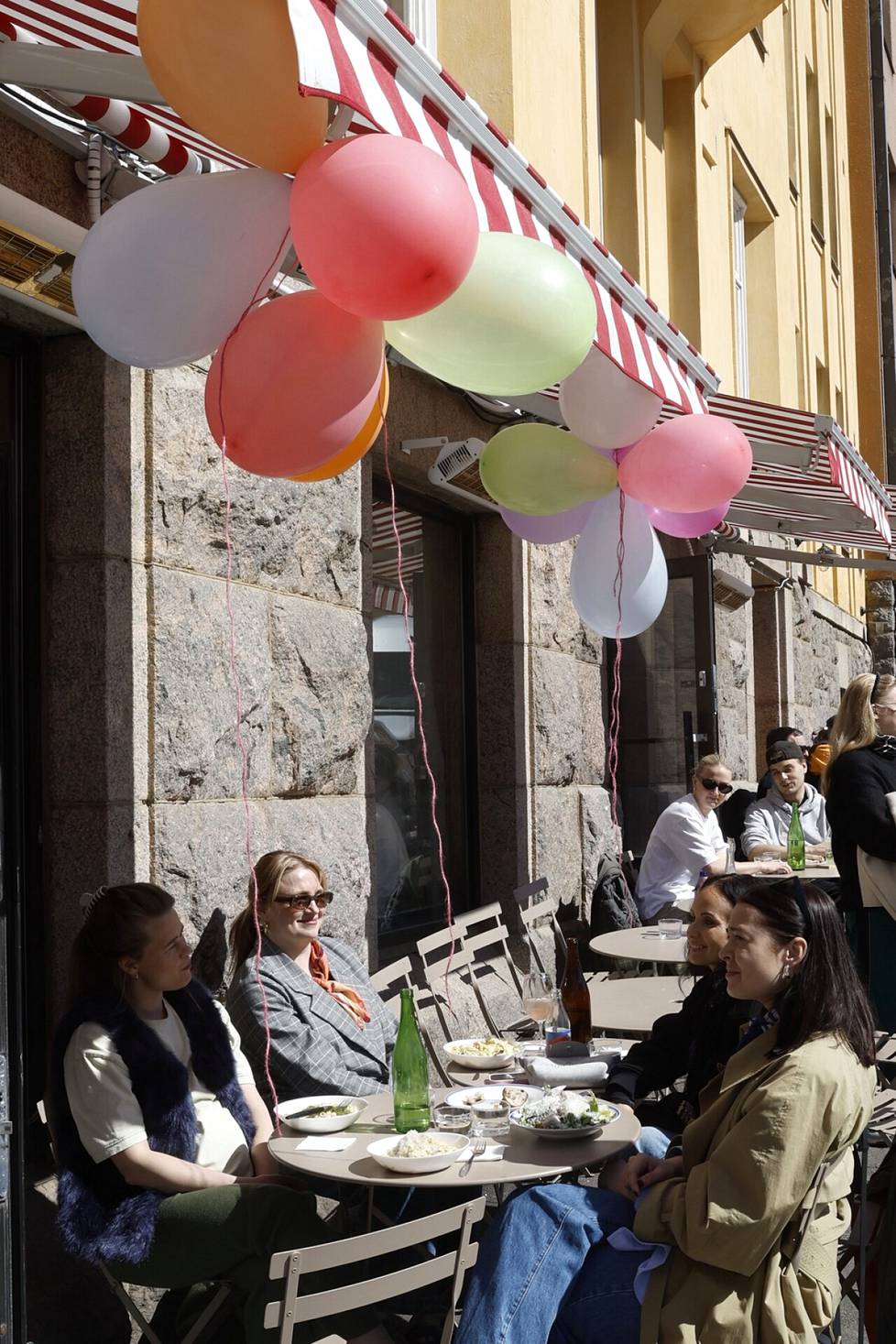 Ina Helkala (left), Elina Riihimäki, Anni Minkkinen and Katariina Kemppainen celebrated May Day with lunch on Way Bakery's terrace.  The friends, who had known each other for twenty years, planned to enjoy donuts and sparkling wine in Käpylä next.