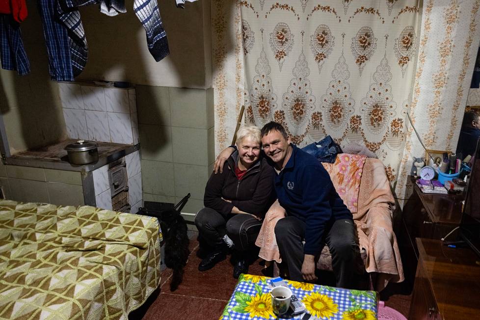 Yelena Diyashkova and Alexander Dokalenko live in a house where parts of the war have been destroyed.  In addition to the kitchen and bathroom, there is one room left.