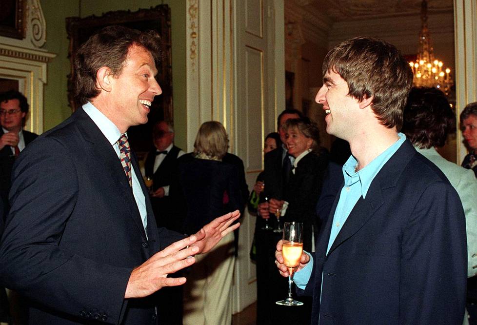 Noel Gallagher (right) has since regretted posing with then-British Prime Minister Tony Blair.