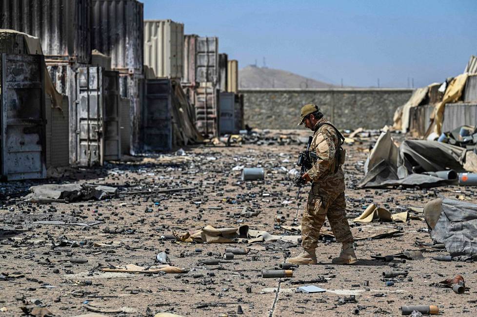 A soldier from the Taliban's Badri 313 Taliban investigated the ruins of a former CIA training center and intelligence station in early September in Deh Sabz.