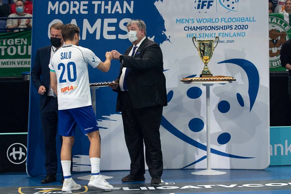 John Liljelund, Secretary General of the International Floorball Federation IFF, distributed silver medals to Finnish players after the final of the December World Championships.  Captain Nico Salo applying for a medal.