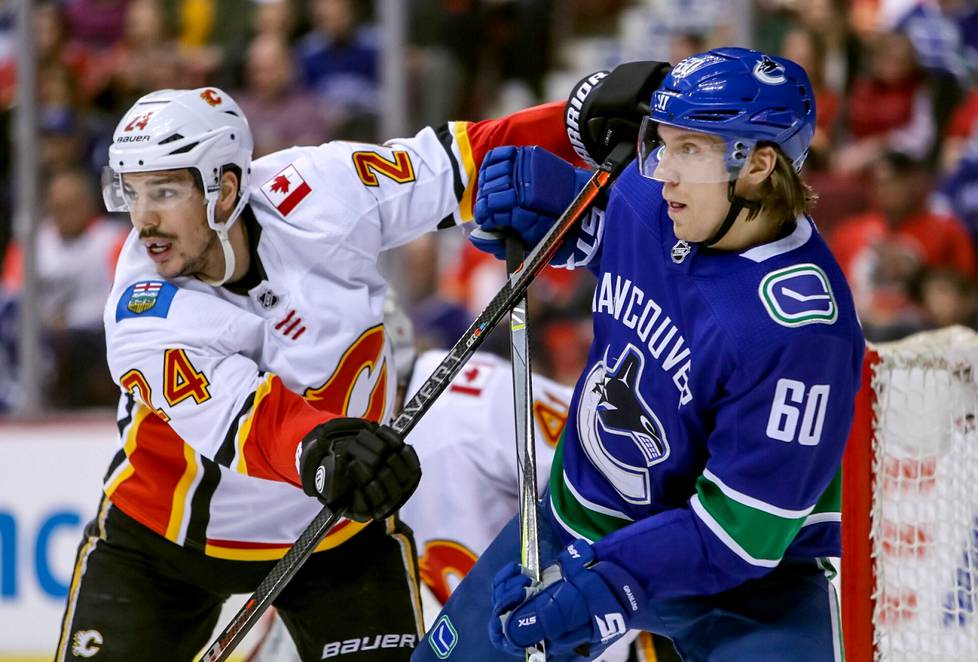 Calgary’s Travis Hamonic defended Vancouver’s Markus Granlund in an NHL match in 2019. 