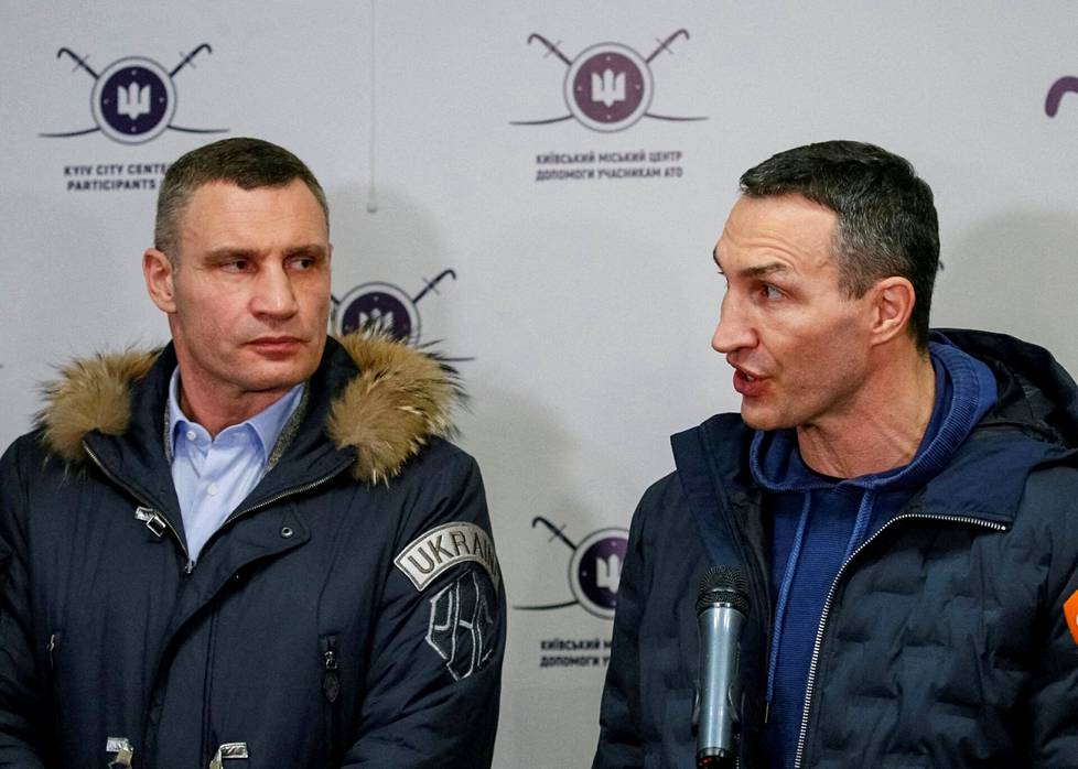 Vladimir Klitschko (right) and his mayor, Vitaly Klitschko, spoke to reporters at the opening of the Ukrainian Regional Defense Recruitment Center in central Kiev in early February.