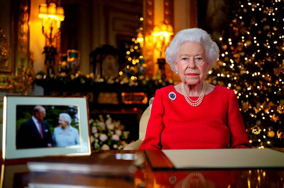 The Queen’s 2021 Christmas speech was pre-recorded at Windsor Castle.  In the foreground photograph, the queen is with her wife Philip, who died in April 2021.