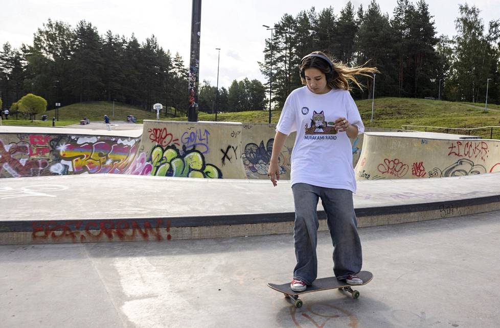 Sofia Smyslova concentrates.  The trick board is shorter than the longboard he's used to, so he's getting used to it now 