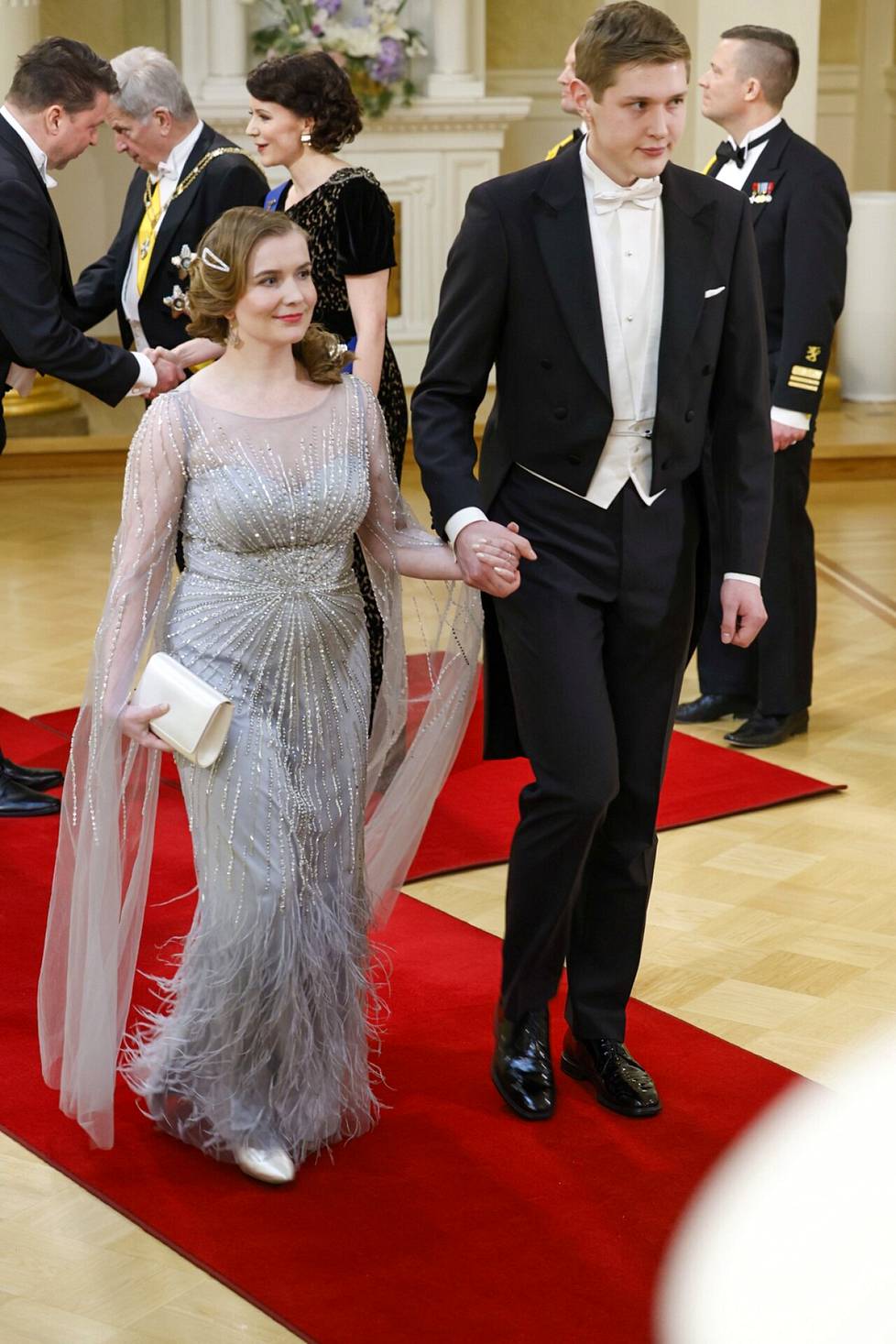 Elina Riutta and Joona Vihervaara, chairpersons of the conscript union.  Riuta's dress was decorated with sparkling details and cape-like gauze sleeves. 